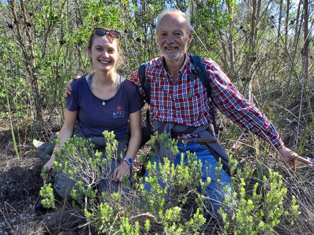 Rachel and Jan behind a Diosma aristata